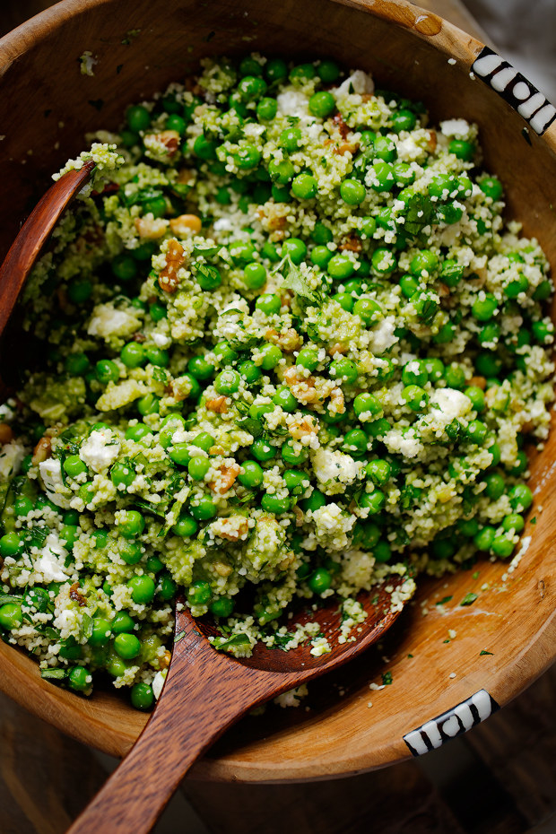 A bowl of couscous with peas.