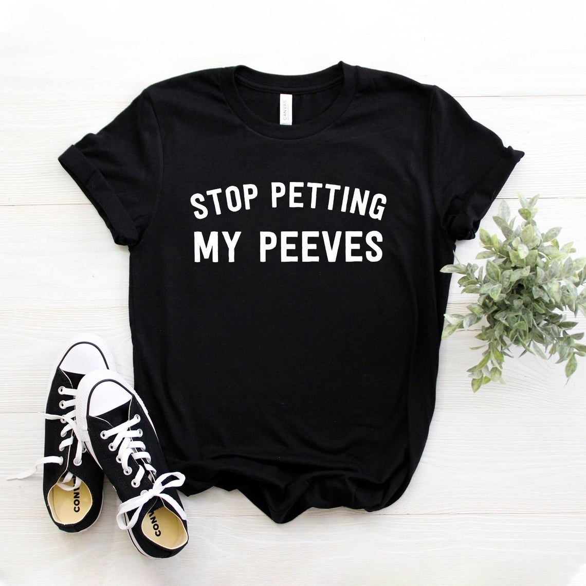 Black shirt that says &quot;Stop Petting My Peeves&quot; 