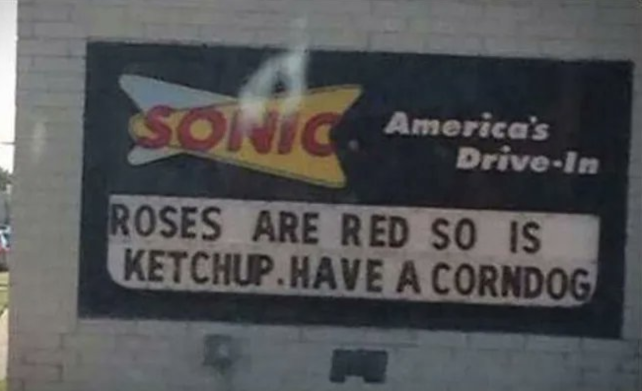 sign reading roses are red so is ketchup have a corndog