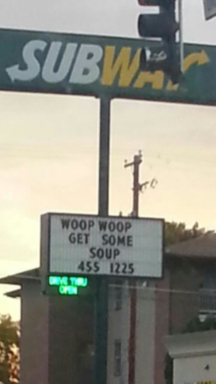 sign reading woop woop get some soup below a Subway logo