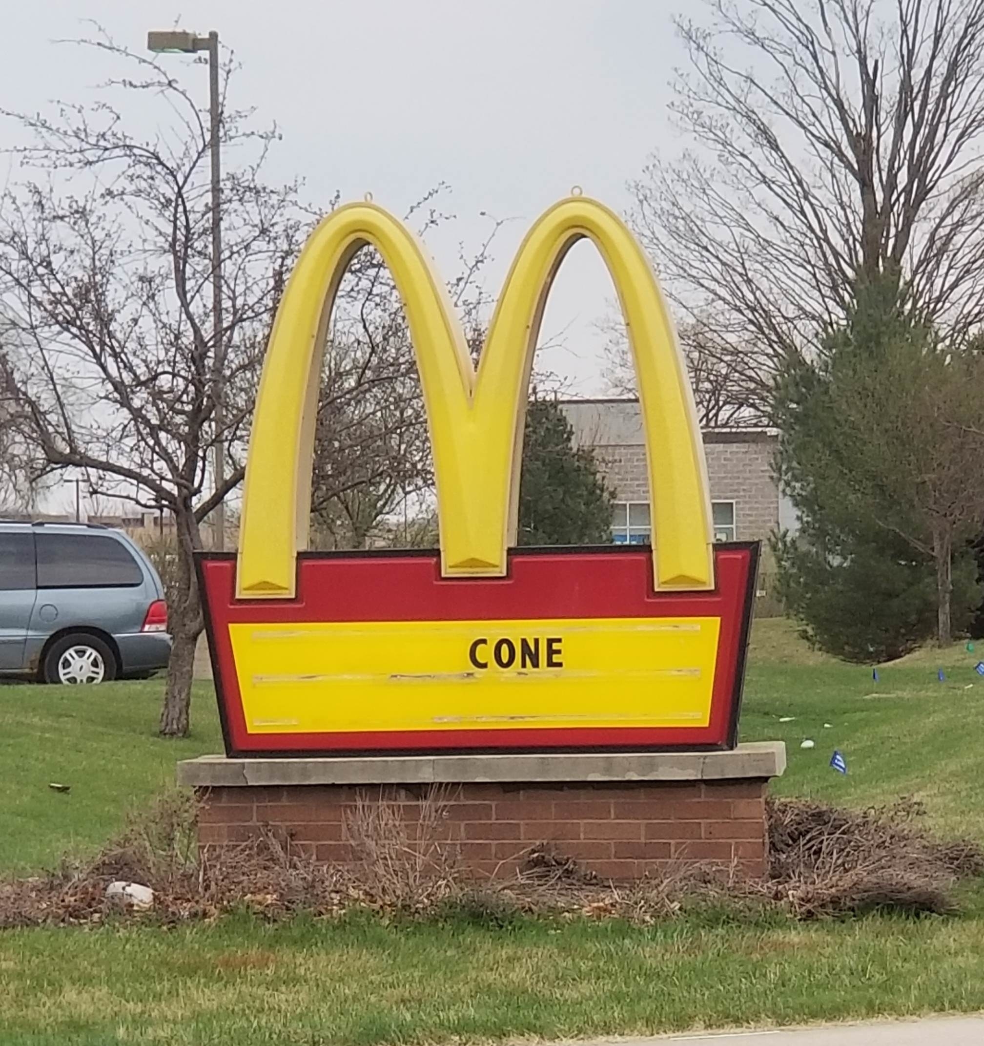 sign reading cone below a McDonald&#x27;s logo