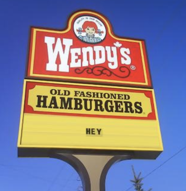 sign reading hey below a Wendy&#x27;s logo