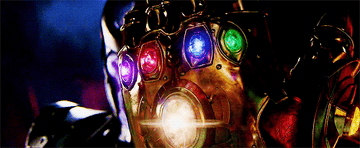 Thanos wielding the Infinity Gauntlet with all of the stones 