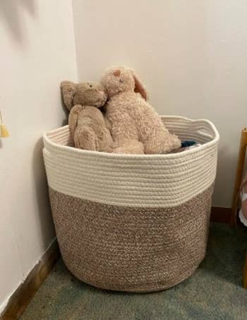 stuffed animals in a brown and white rope storage basket