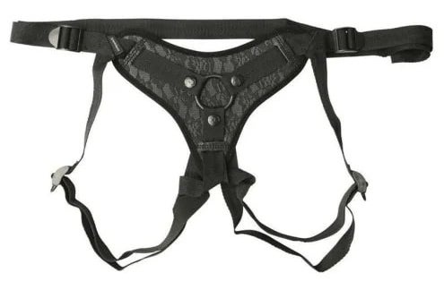The black harness with intricate lace details on the front