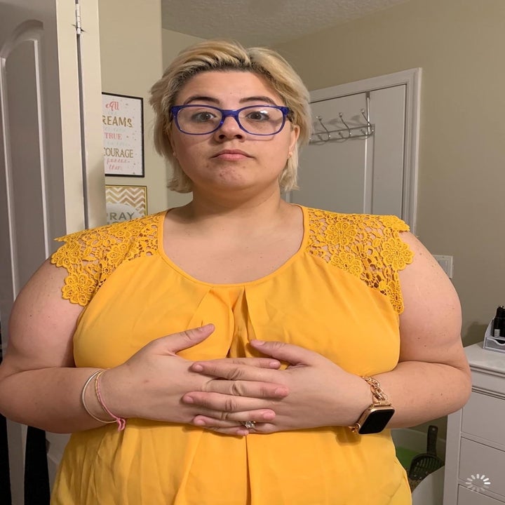 The blouse in yellow worn by an Amazon reviewer