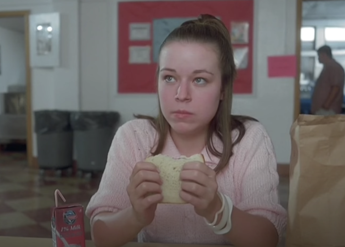 Tina eating lunch in the cafeteria in the film