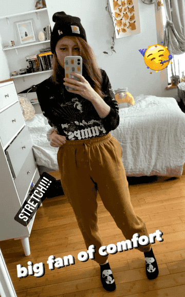 instagram story gif of reviewer stretching out the waistband that says &quot;big fan of comfort&quot; 