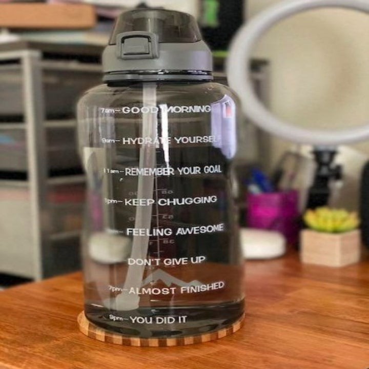 black water bottle with motivational sayings on it