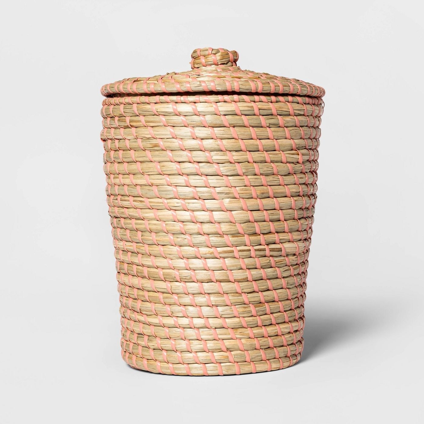 Brown and white wicker wastebasket with lid
