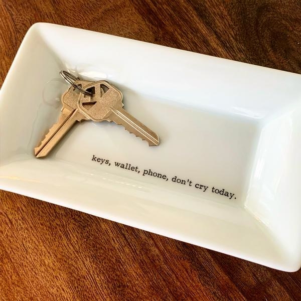 a white ceramic key dish that says &quot;keys, wallet, phone, don&#x27;t cry today&quot;