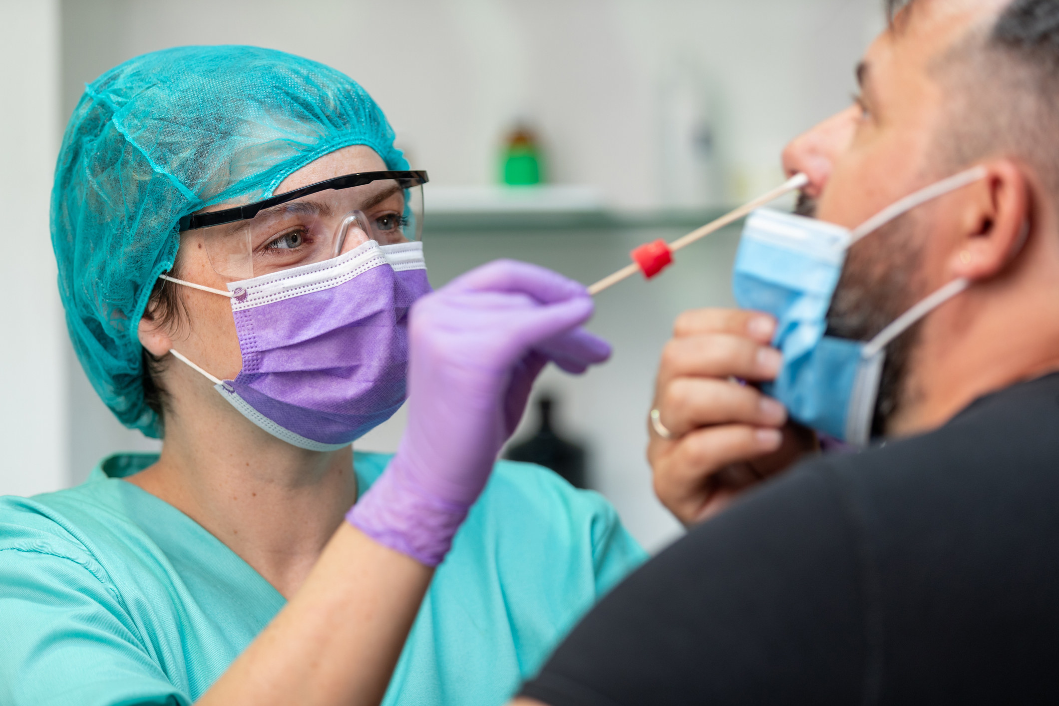 Doctor giving a patient a COVID test