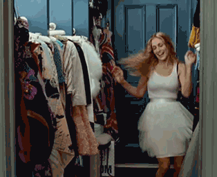 Carrie from Sex and the City dancing in a walk-in closet