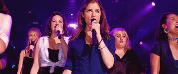 The Pitch Perfect group all singing on stage together