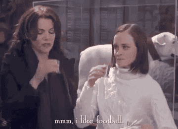 Rory and Lorelai Gilmore taking a shot with the caption &quot;Mmmm, I like football&quot;