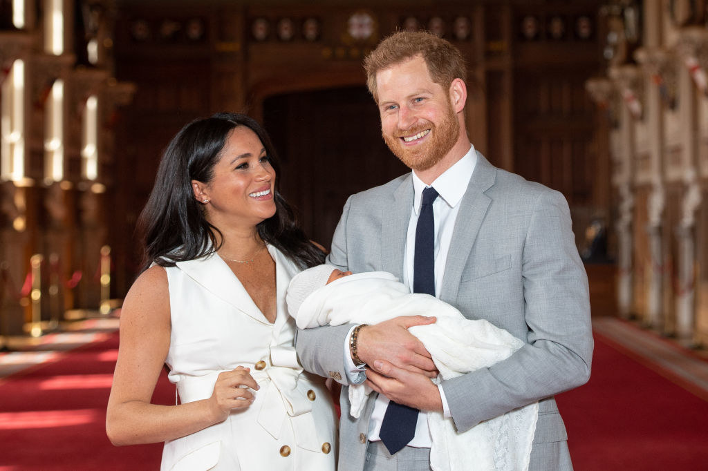 Prince Harry and Meghan pose with their newborn son Archie during a photocall in St George&#x27;s Hall at Windsor Castle