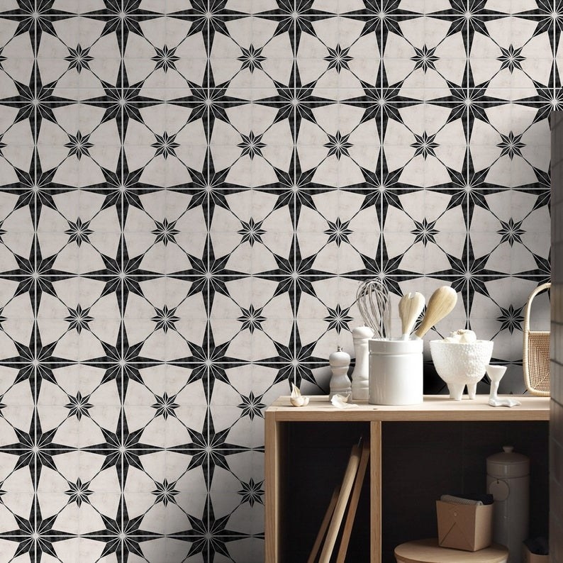 black and white tile decals on a kitchen wall