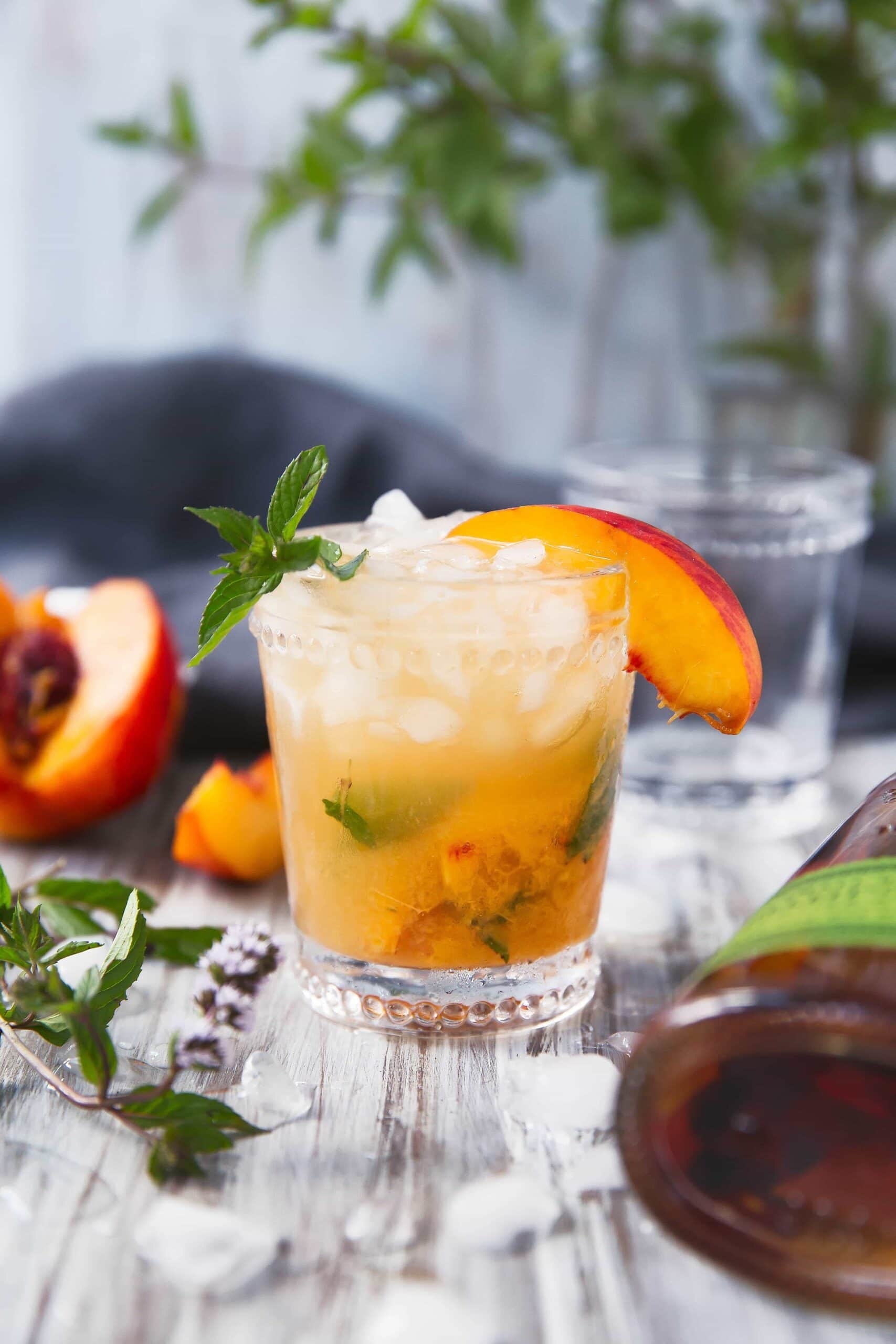 A peach mint julep cocktail.