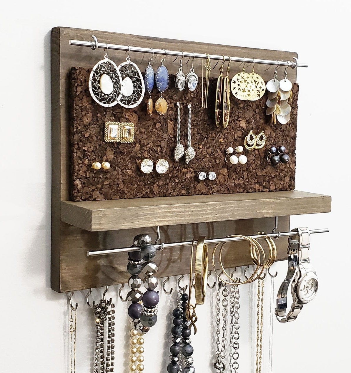 photo of the jewelry organizer styled with necklaces and bracelets and earrings