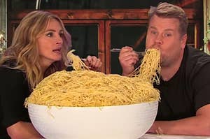 Julia Roberts and James Corden eating a giant bowl of pasta together