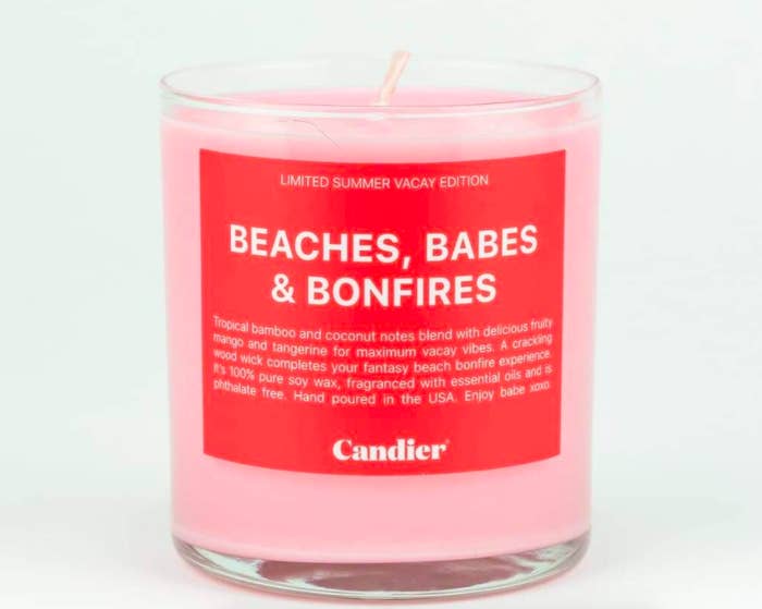 Pink candle that says &quot;Beaches, Babes, &amp;amp; Bonfires&quot; 