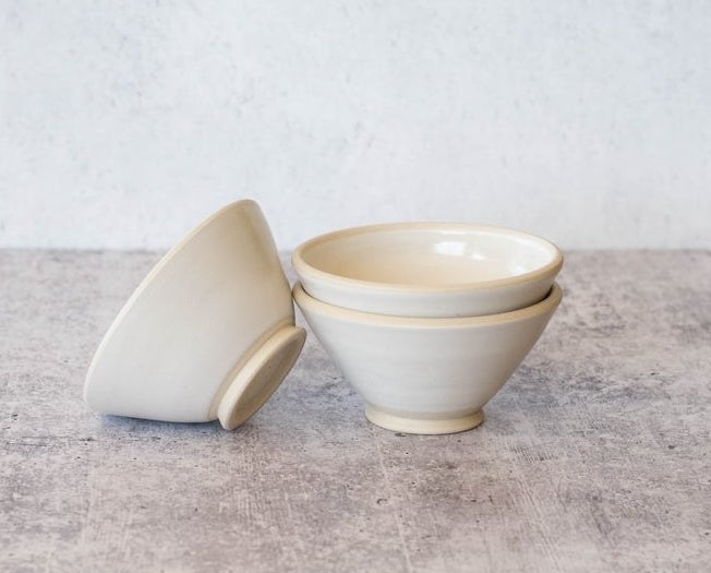small white bowl with stand on the bottom