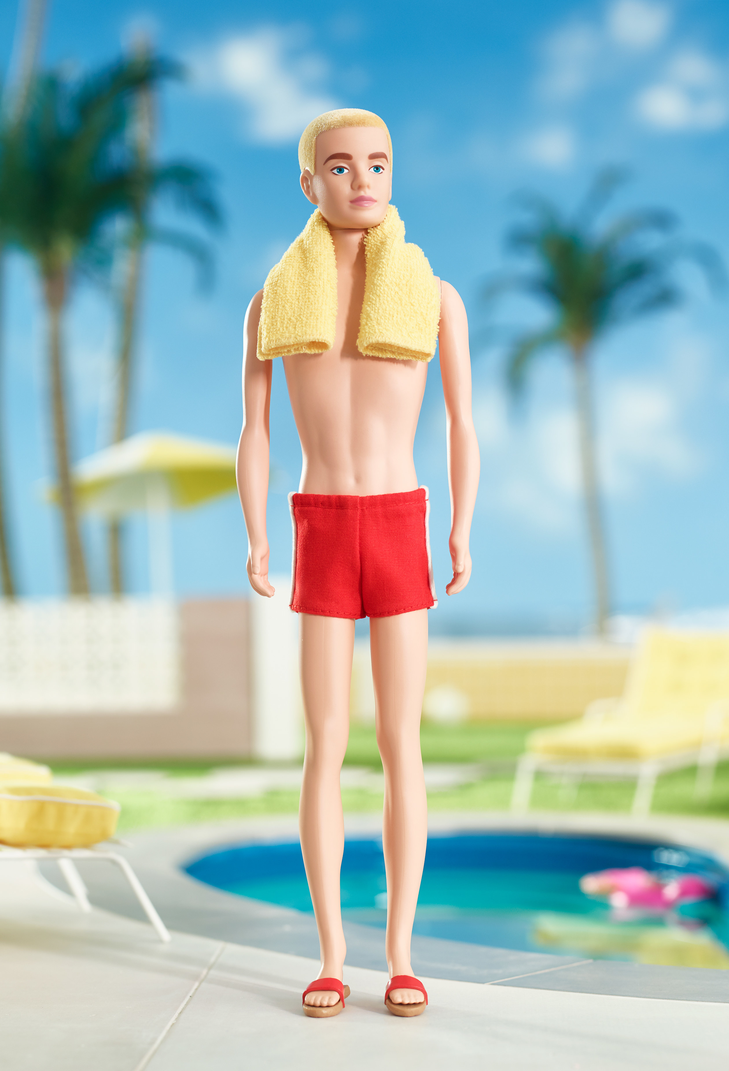 The original Ken doll in a red swim suit and with blonde hair