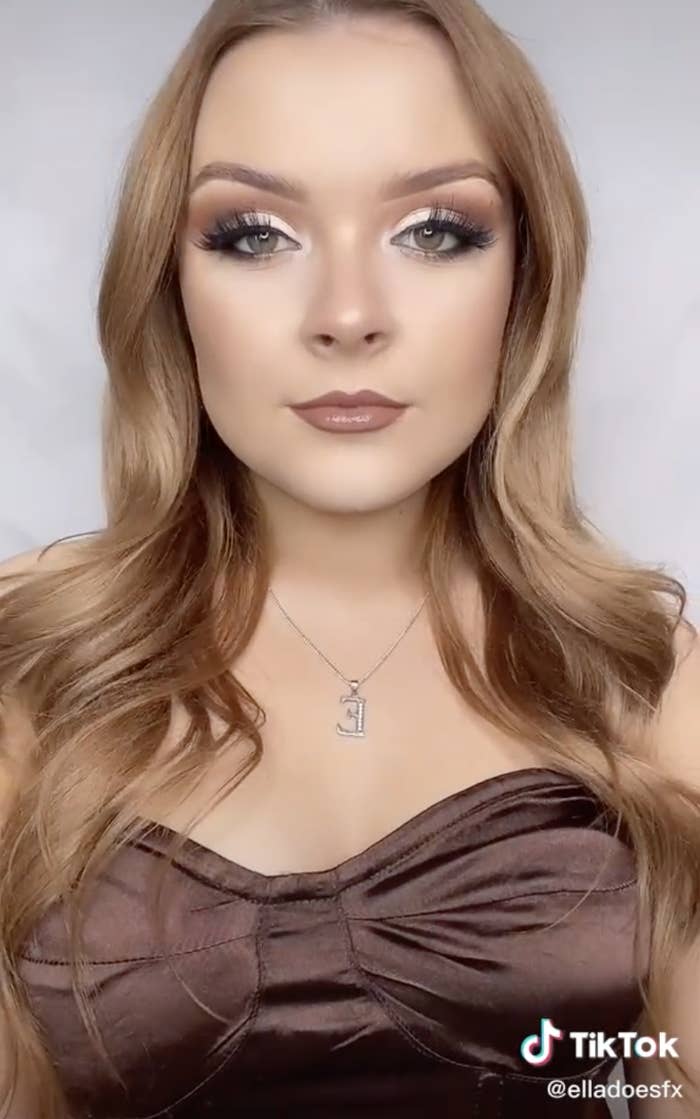 Ella with a soft glam makeup look and curled hair