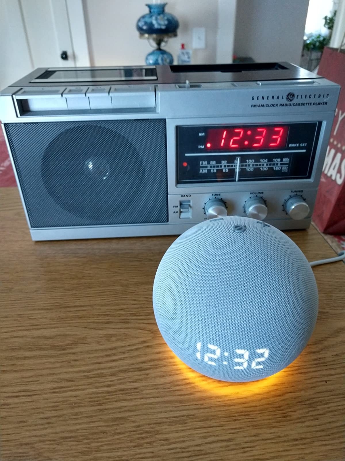 A comparison between a reviewer&#x27;s old clock radio and the Dot
