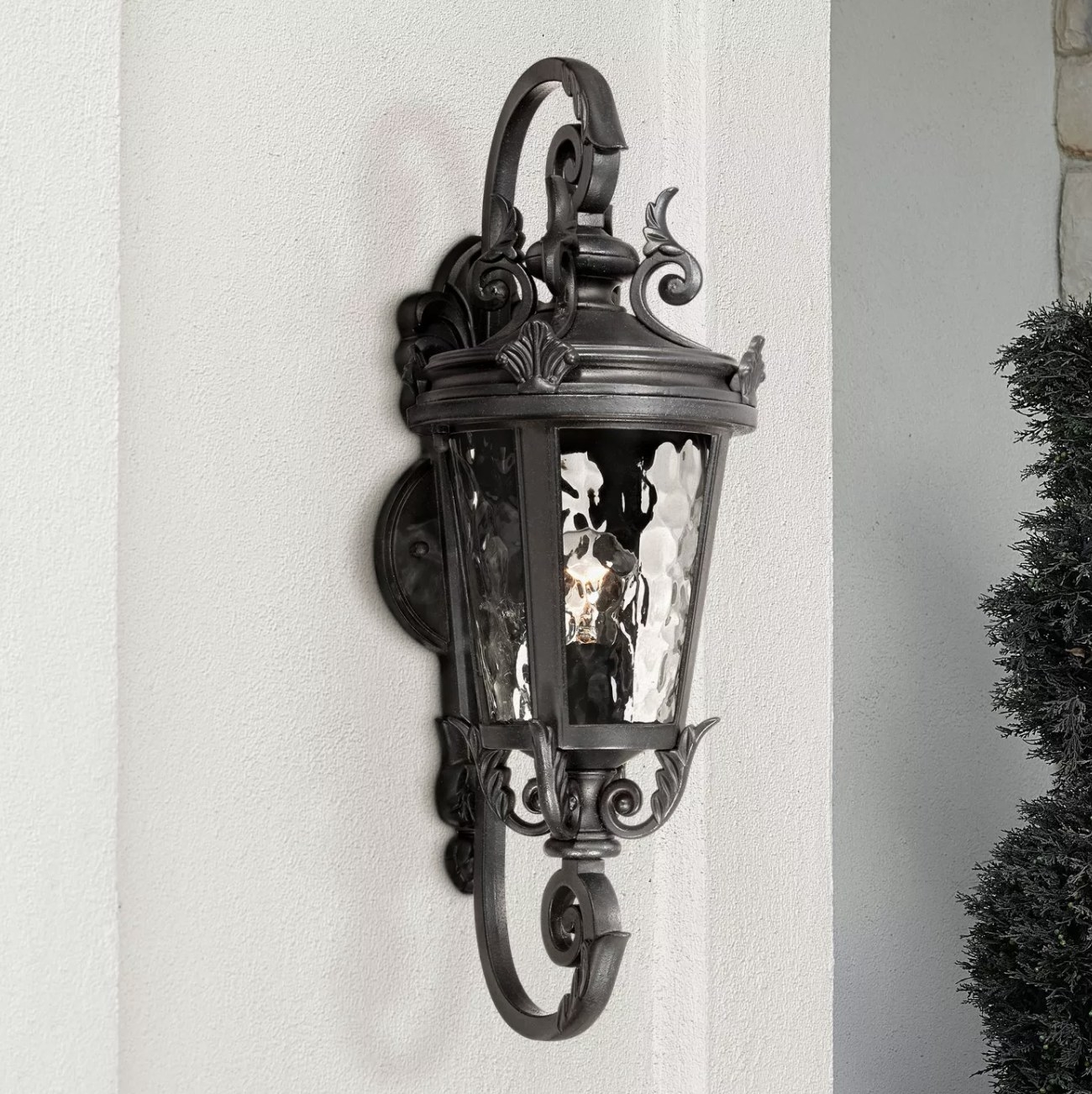 A black iron light fixture mounted on a wall