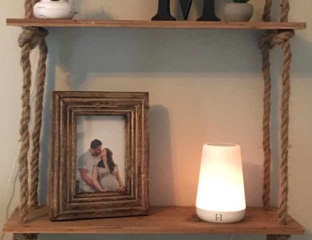Rope shelf with picture of a white couple and a glowing light