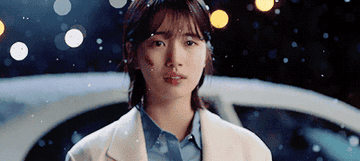 Suzy looks into the distance in While You Were Sleeping