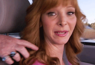 Lisa Kudrow gets her hair touched up while driving in &quot;The Comeback.&quot;