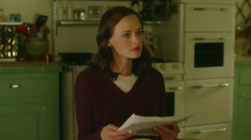 Rory Gilmore in &quot;Gilmore Girls: A Year in the Life&quot; holding a transcript of her book