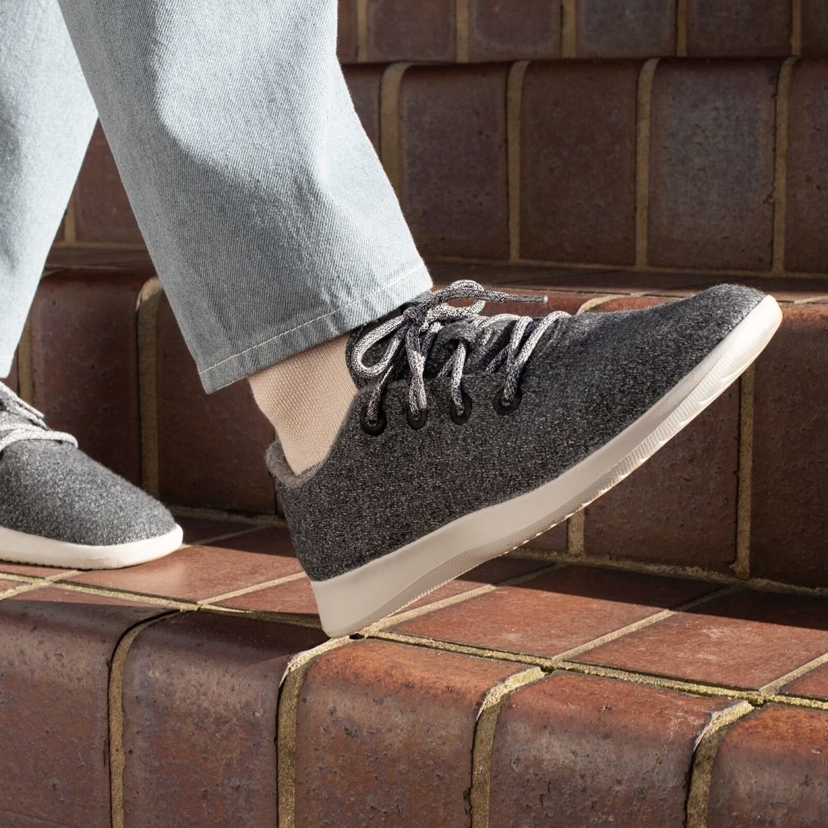 person walking on a step with the wool runners on