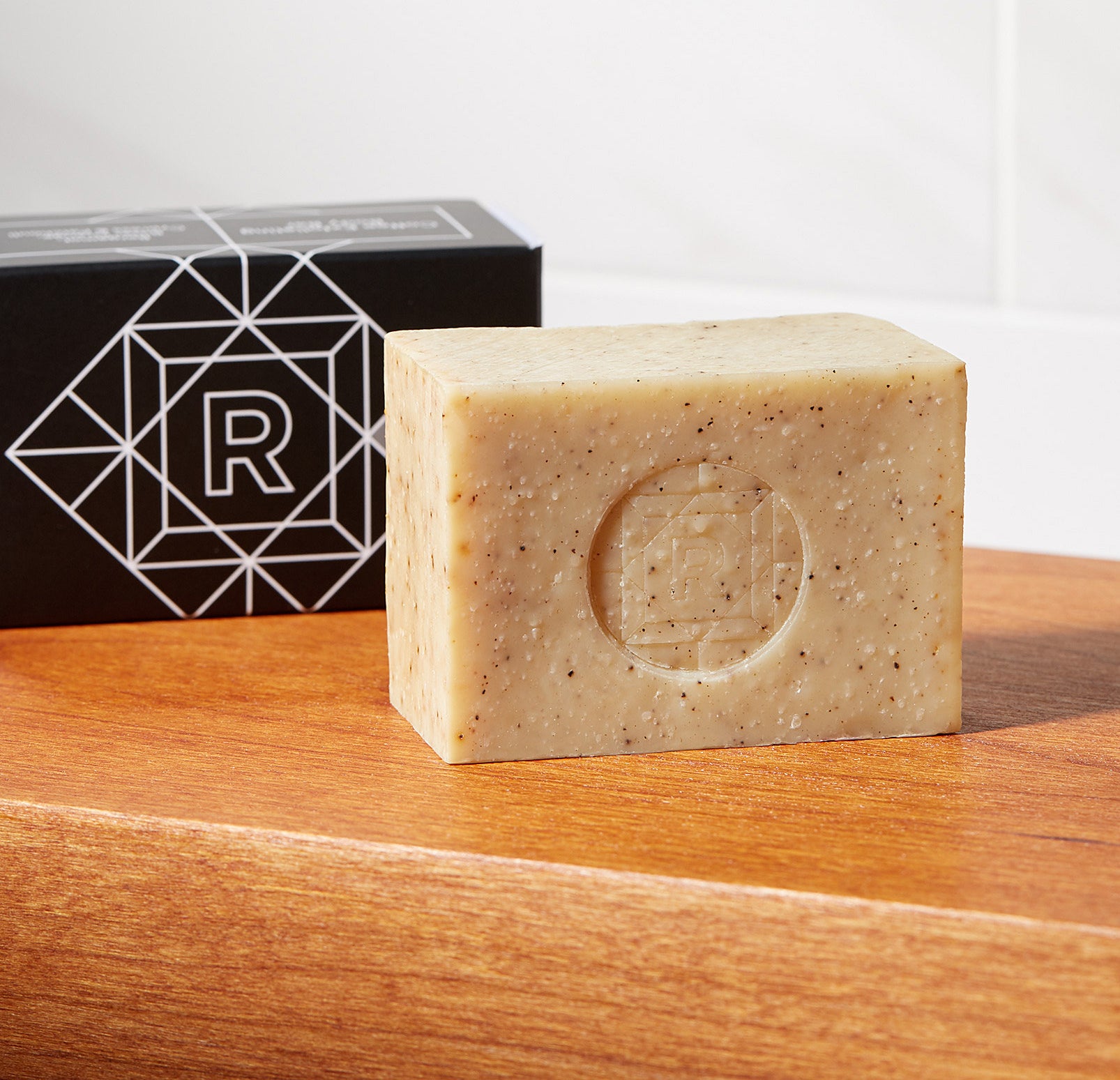 A bar of soap on a wooden table