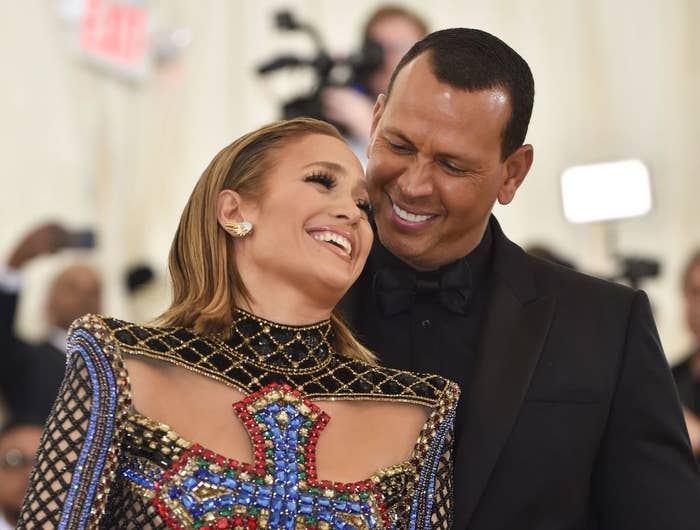 Jlo and A Rod smiling on the Met Gala red carpet in 2018
