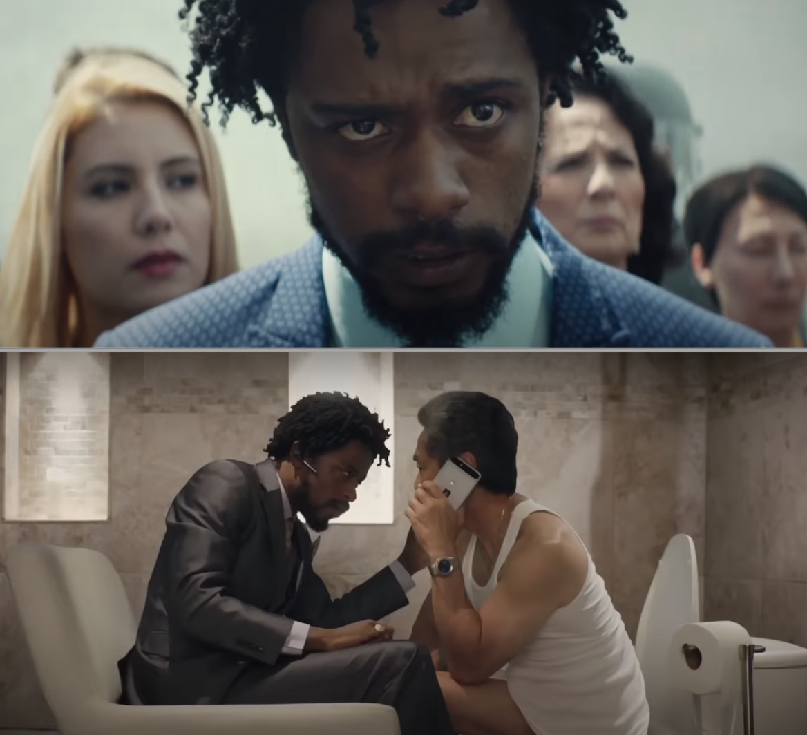 Lakeith Stanfield in a blue suit and talking to someone on the toilet, lol
