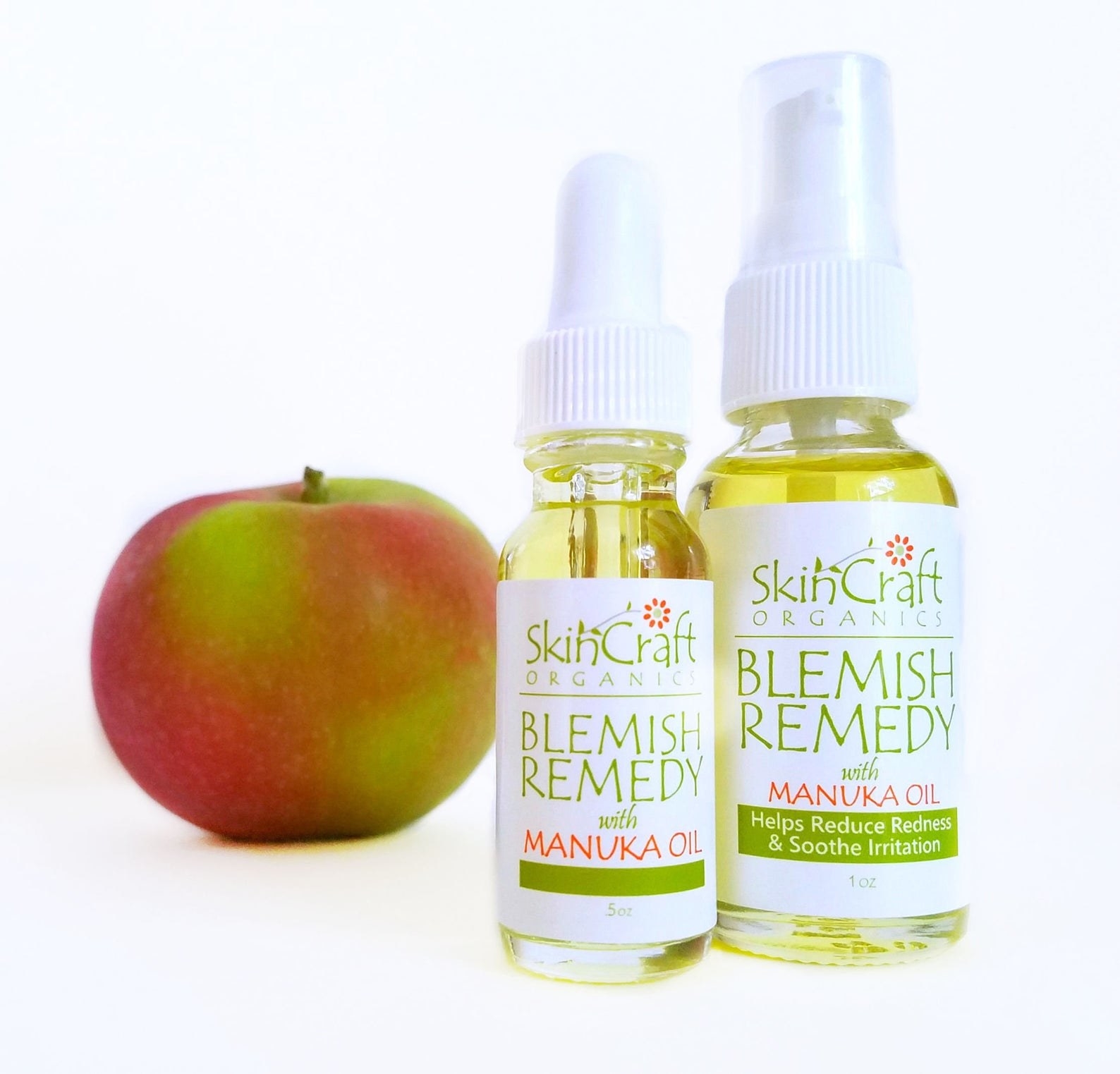 Two bottles of SkinCraftOrganics Blemish Remedy in different sizes with an apple in the background