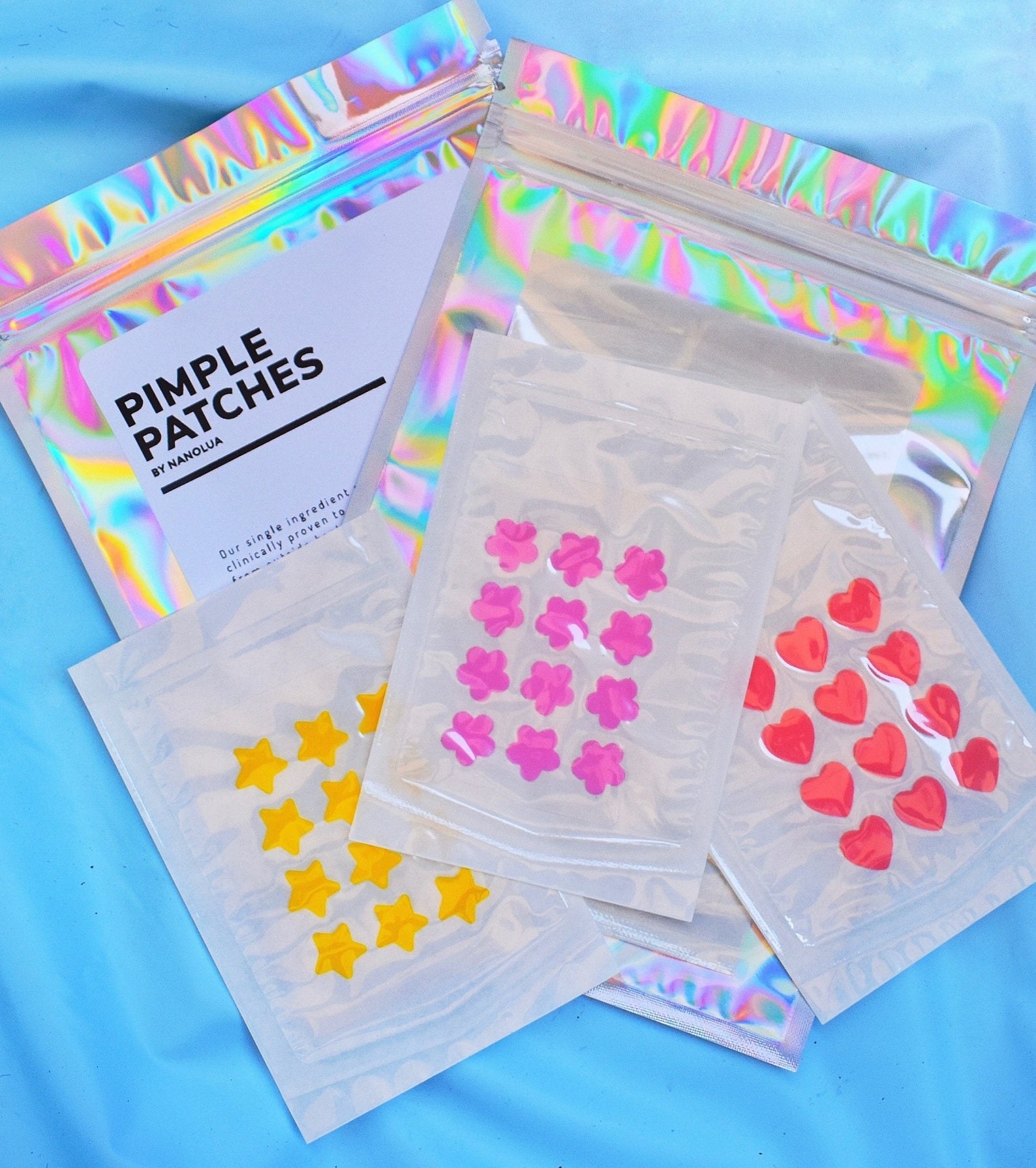 Pack of NanoLuaShop Pimple Patches in various shapes and colors