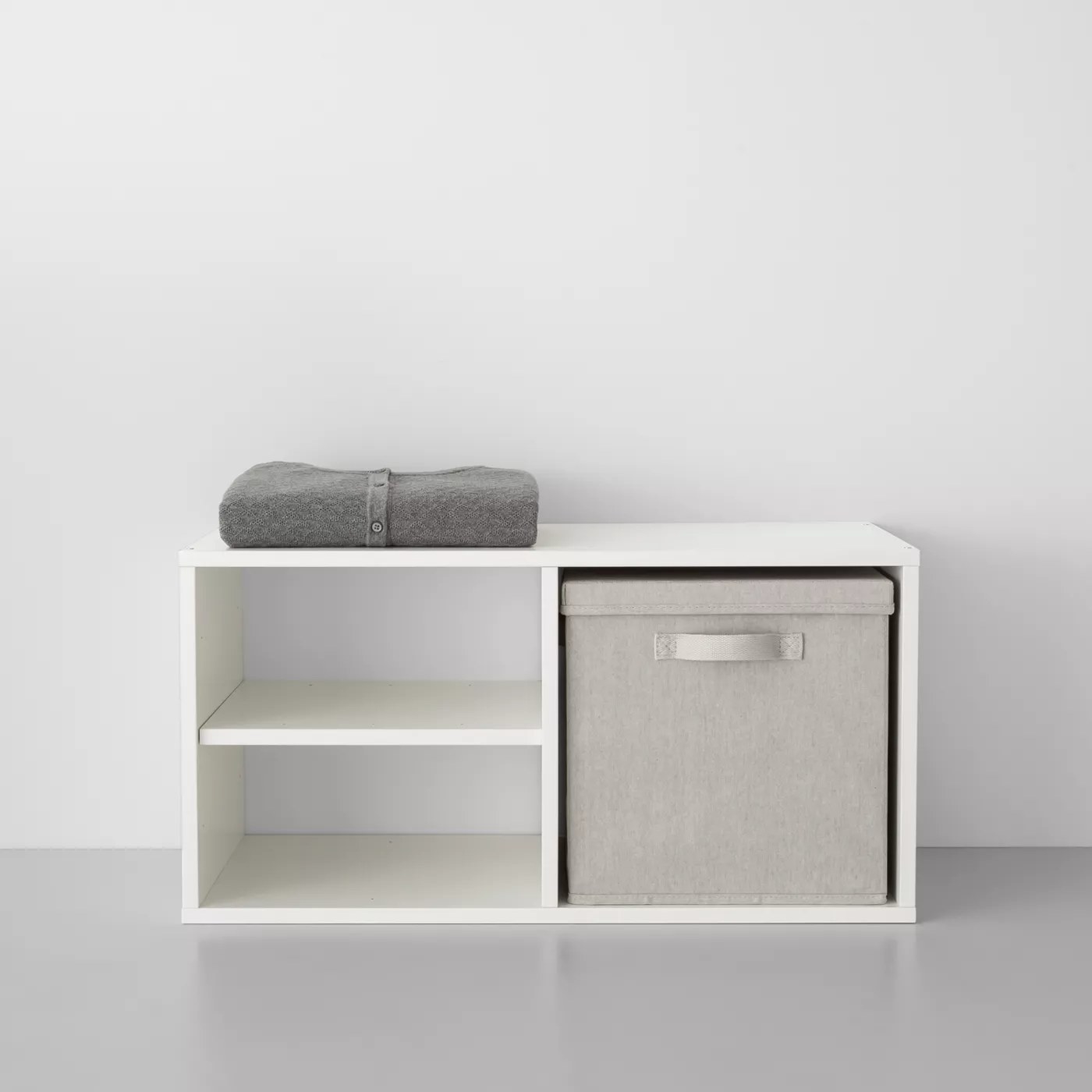 White three-shelf unit with storage box