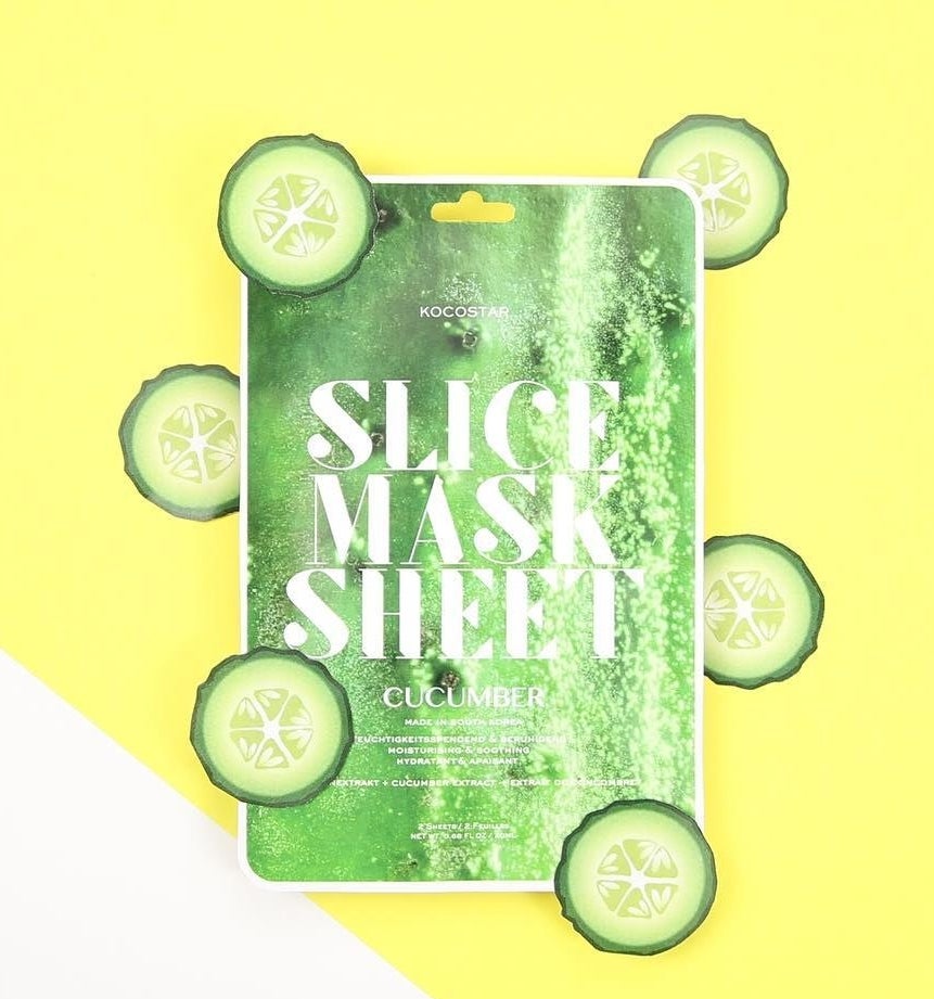 A flatlay of the face masks with the sliced &quot;cucumber&quot; arranged around it