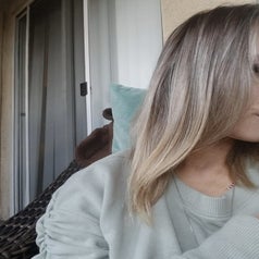 The reviewer showing their hair after the mask. 