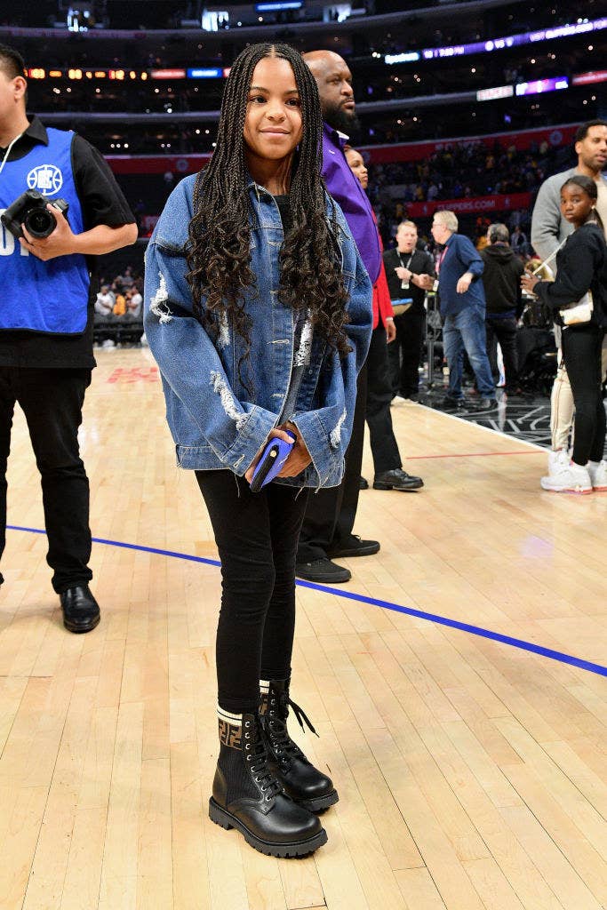 Blue Ivy standing on the court at an NBA basketball court