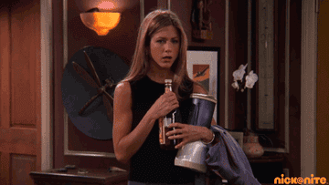Rachel from "Friends" opening a bottle of booze.