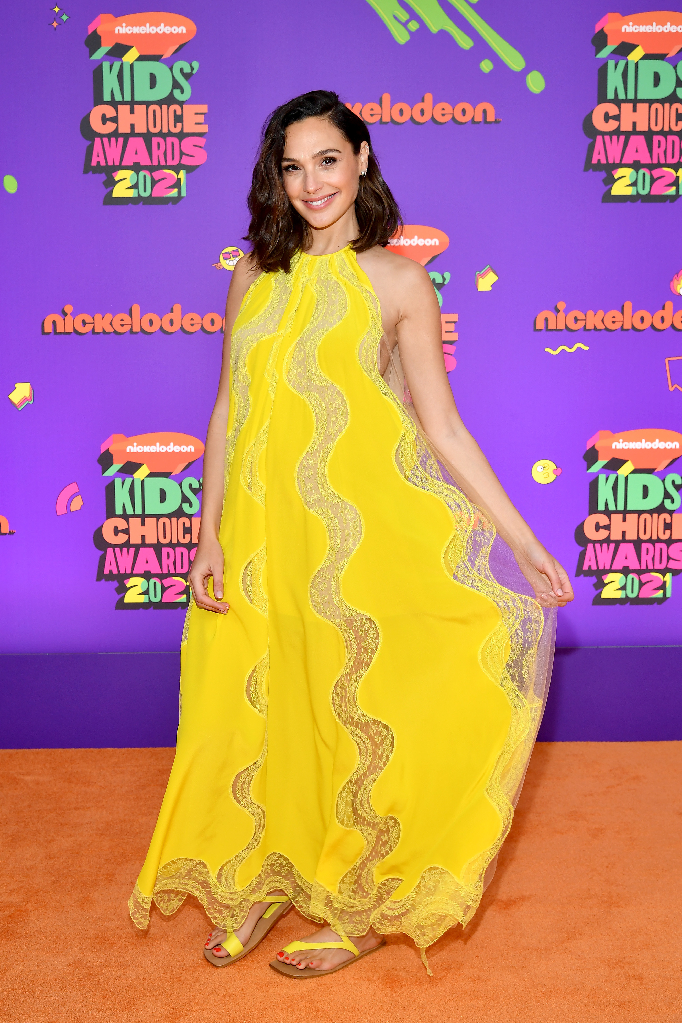 Gal in a yellow flowy maxi dress