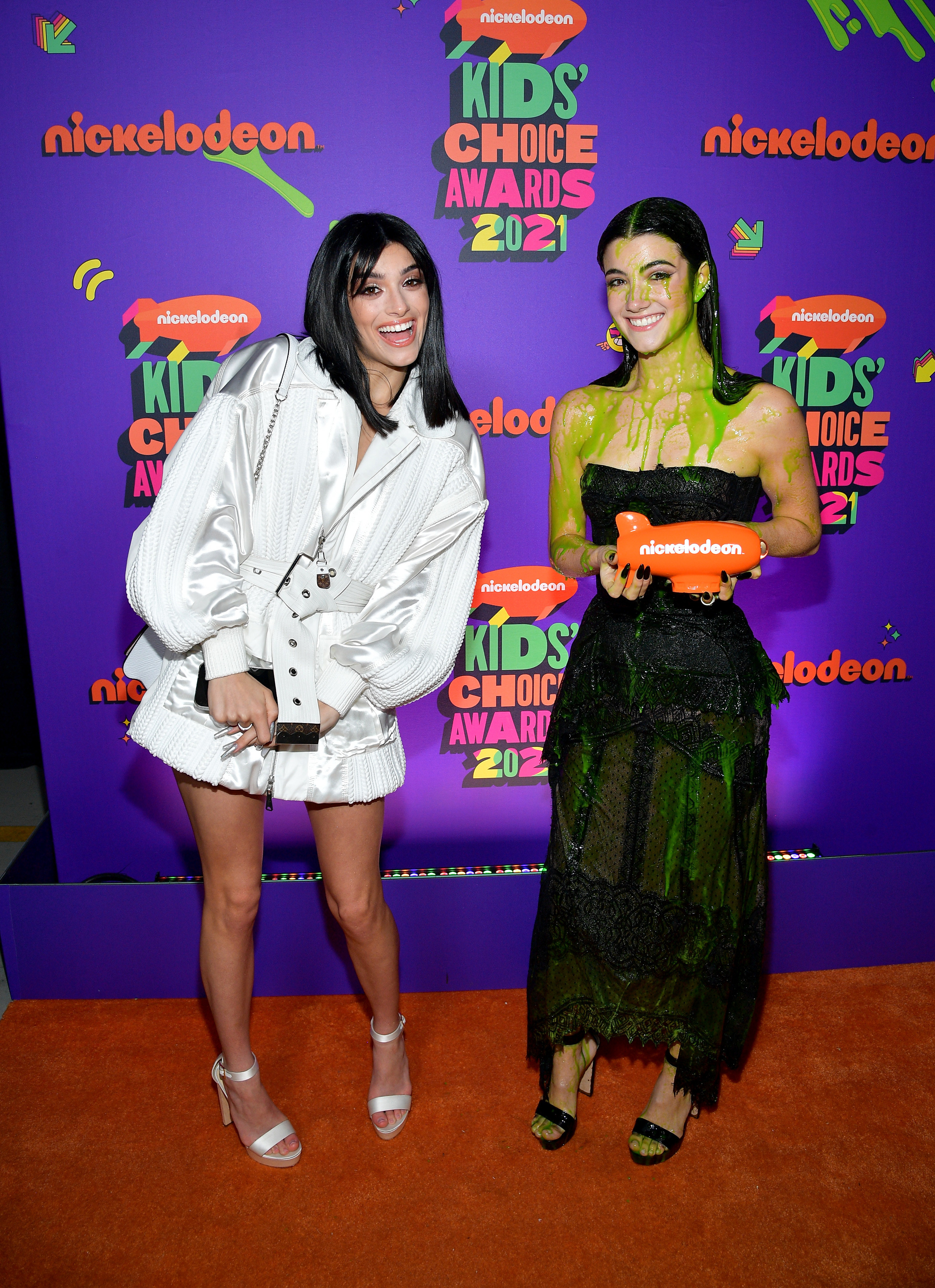 Dixie posing next to Charli after Charli was slimed