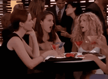 Carrie, Charlotte, and Miranda drinking cosmopolitans in "Sex and the City."