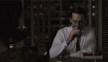 Don Draper drinking whiskey in &quot;Mad Men.&quot;