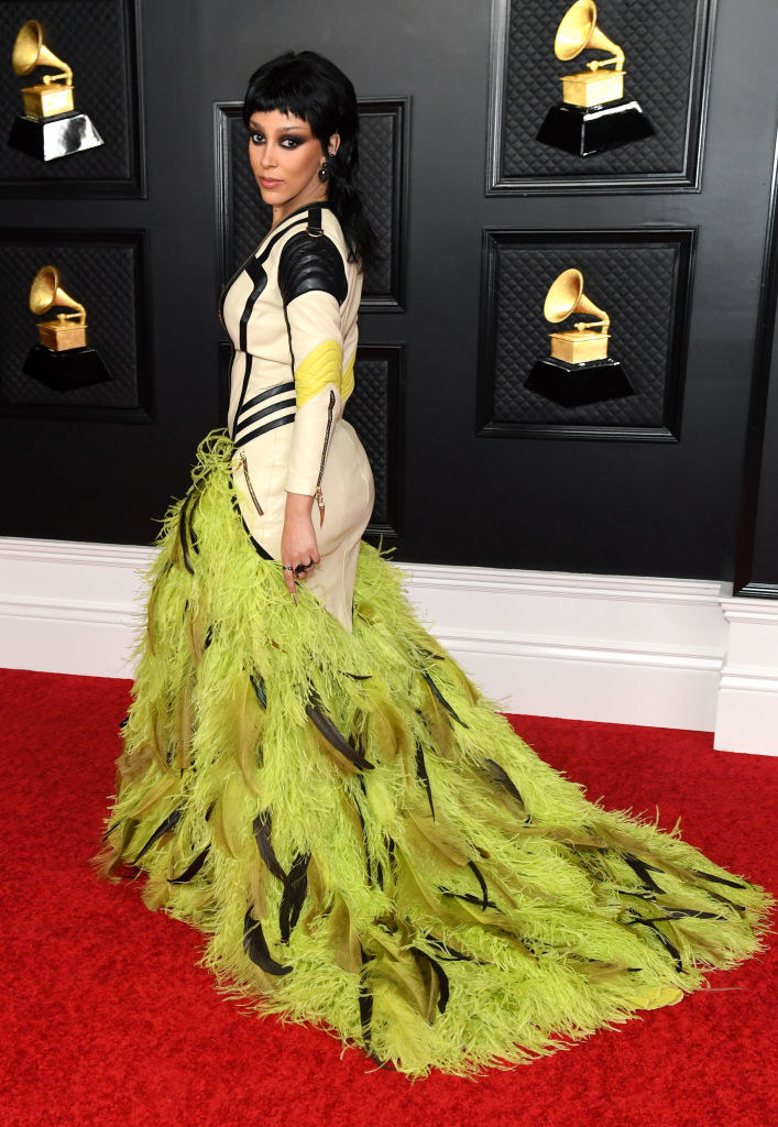 Doja Cat walks the red carpet at the 2021 Grammys in a fitted motorcycle jacket dress 